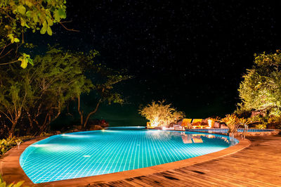 View of swimming pool at night