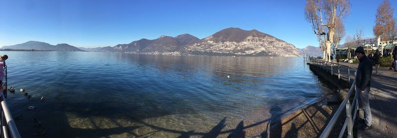 Panoramic view of sea against clear blue sky