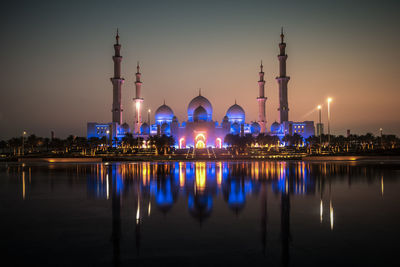 Reflection of illuminated buildings in water at night