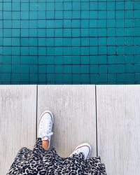 Full length of man standing by swimming pool