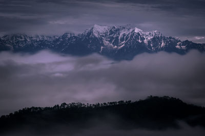 Scenic view of mountains against sky during winter