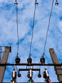 Low angle view of street light against sky