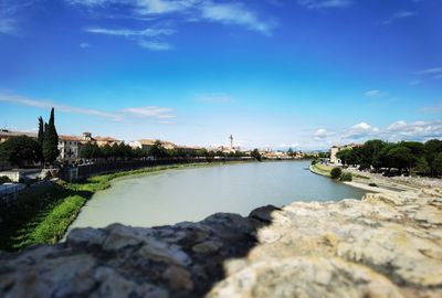 View of bridge over river against cloudy sky