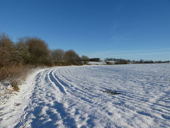 Scenic view of snow field against sky