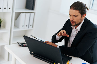 Businessman talking on video conference at office