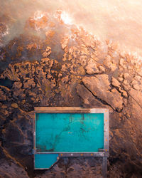 Aerial image of a rock pool at sunrise