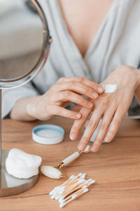 Midsection of woman massaging at spa