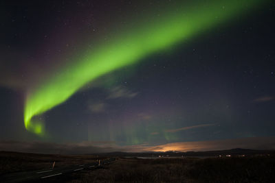 Scenic view of landscape against sky at night