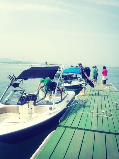 water, sea, nautical vessel, boat, moored, sky, transportation, horizon over water, mode of transport, beach, tranquility, tranquil scene, nature, day, pier, scenics, blue, travel, outdoors, shore