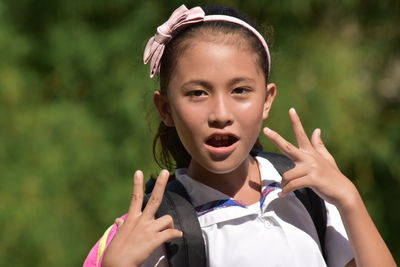 Portrait of cute girl holding camera