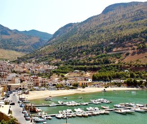 Scenic view of the sea and mountains against sky in sicily