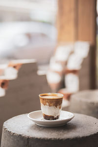 Close-up of cappuccino on table at cafe