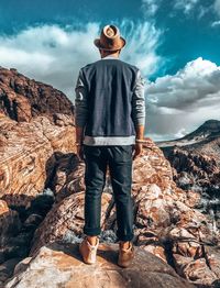 Full length of man standing on rock