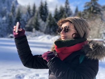 Portrait of woman wearing hat during winter