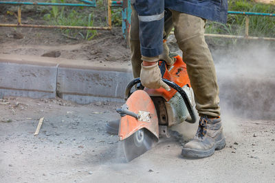 Low section of men working at construction site