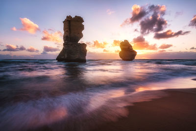 Gibson steps along the great ocean road at sunset.