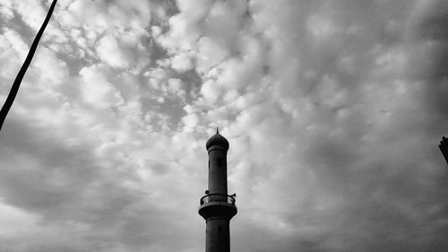 Low angle view of communications tower against sky