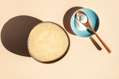 High angle view of breakfast on table against white background