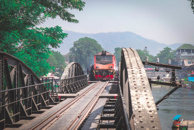 Train on bridge against sky