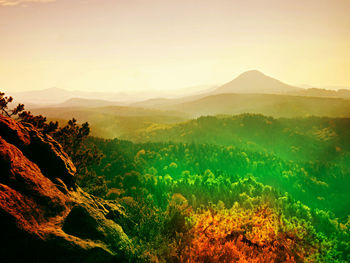 Scenic view of landscape against sky during sunset