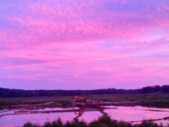 Scenic view of lake at sunset