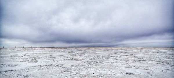 Scenic view of sea against sky during winter