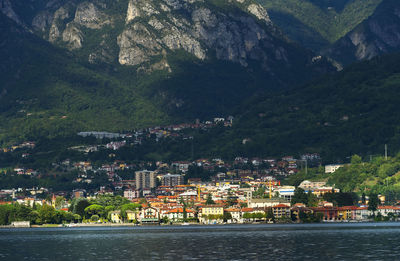 Calm lake with built structures on landscape