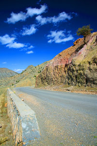 Surface level of country road against clear sky