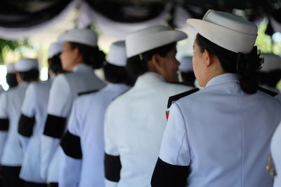 Rear view of female army soldiers during military parade