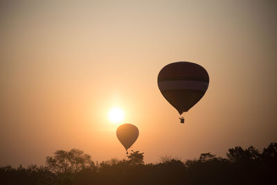 Hot air balloon against sky during sunset