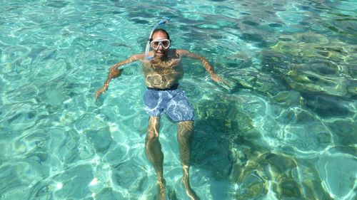 High angle view of woman swimming in pool