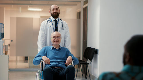 Doctor with patient in clinic