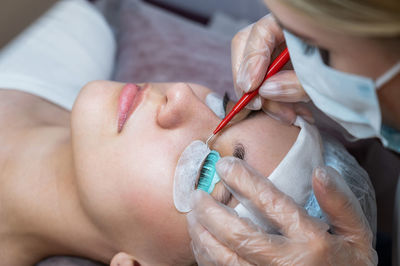 Midsection of doctor examining patient at clinic