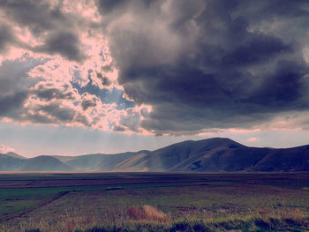 Scenic view of landscape against sky during sunset