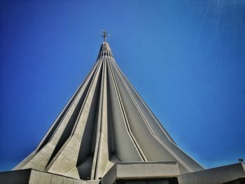 Low angle view of building against blue sky