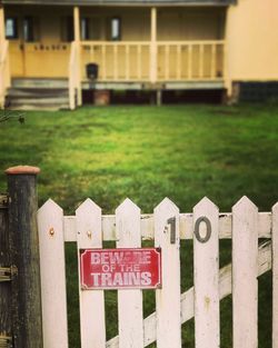 Close-up of text on fence