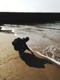 High angle view of shoes on sand at beach