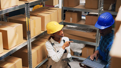 Side view of man working in factory