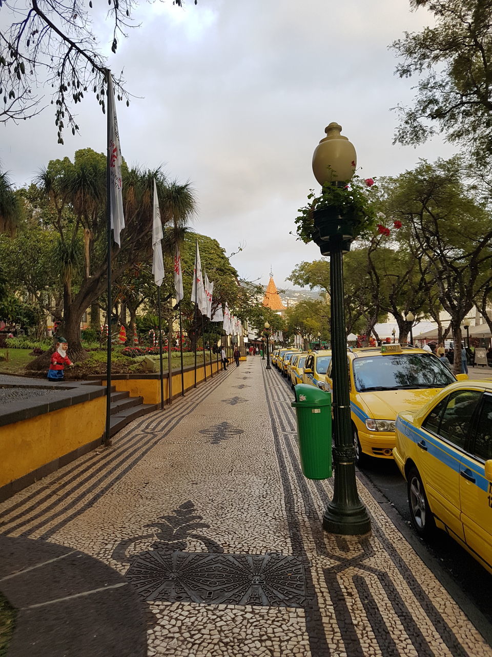 CARS ON STREET AGAINST SKY