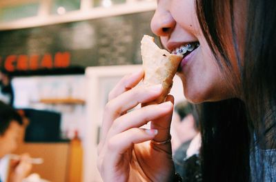 Close-up of woman eating ice cream