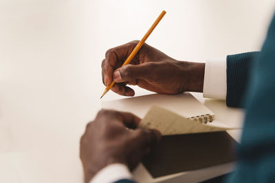 Midsection of man working in office