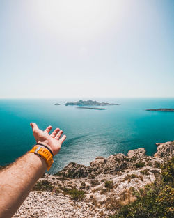 Human hand facing nature.