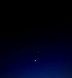 Scenic view of moon against clear sky at night