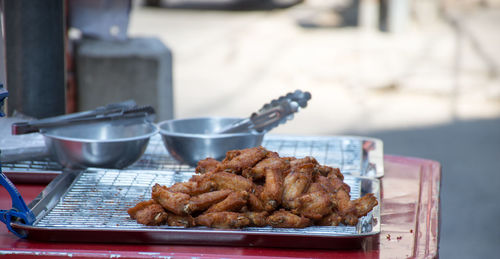 Close-up of meat in tray on table