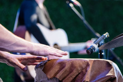 Cropped image of musician playing drum