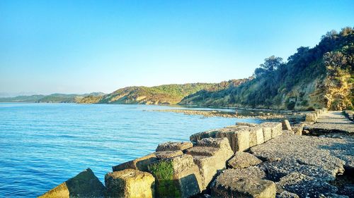 Scenic view of sea against clear blue sky