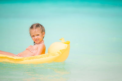 Cute baby girl in swimming pool