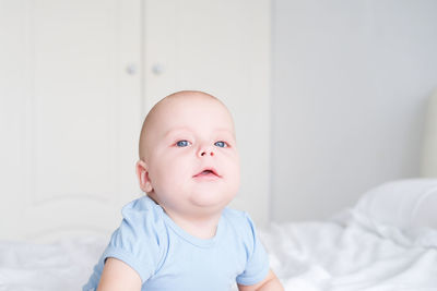 Close-up of cute baby boy at home