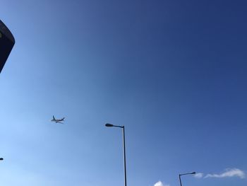 Low angle view of airplane flying in sky