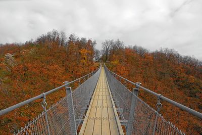 Bridge against sky during autumn